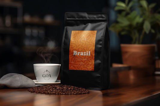 Goa Specialty Coffee Brazil Fazenda Nunes blend, featuring coffee beans from Brazil, next to a steaming cup of coffee, highlighting flavors of caramel, milk chocolate, and snickers.