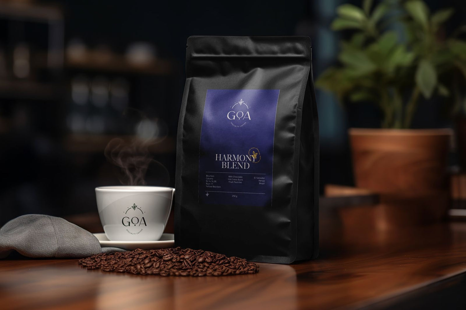 A bag of Goa Specialty Coffee Harmony Blend placed beside a steaming cup of coffee, surrounded by coffee beans on a wooden table, capturing the essence of premium coffee.